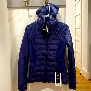 Brand new (never worn) women’s size 6 Lululemon Primaloft navy hooded jacket .